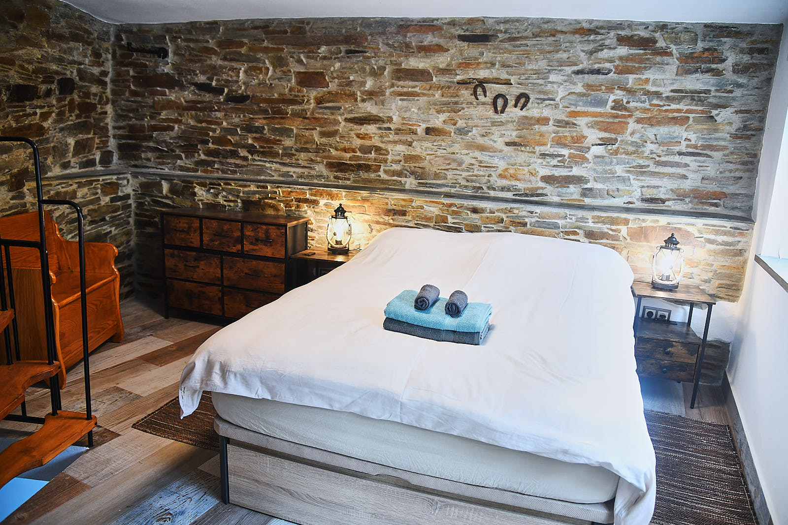 Casa da Égua bedroom with white bedding, lanterns and traditional decor