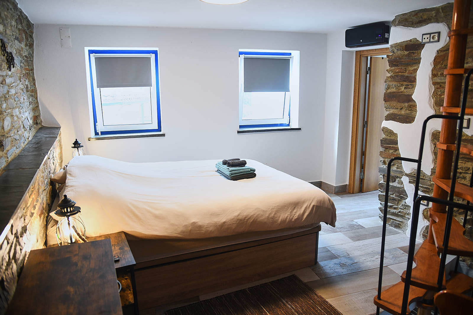 Casa da Égua bedroom with white bedding, lanterns and traditional decor